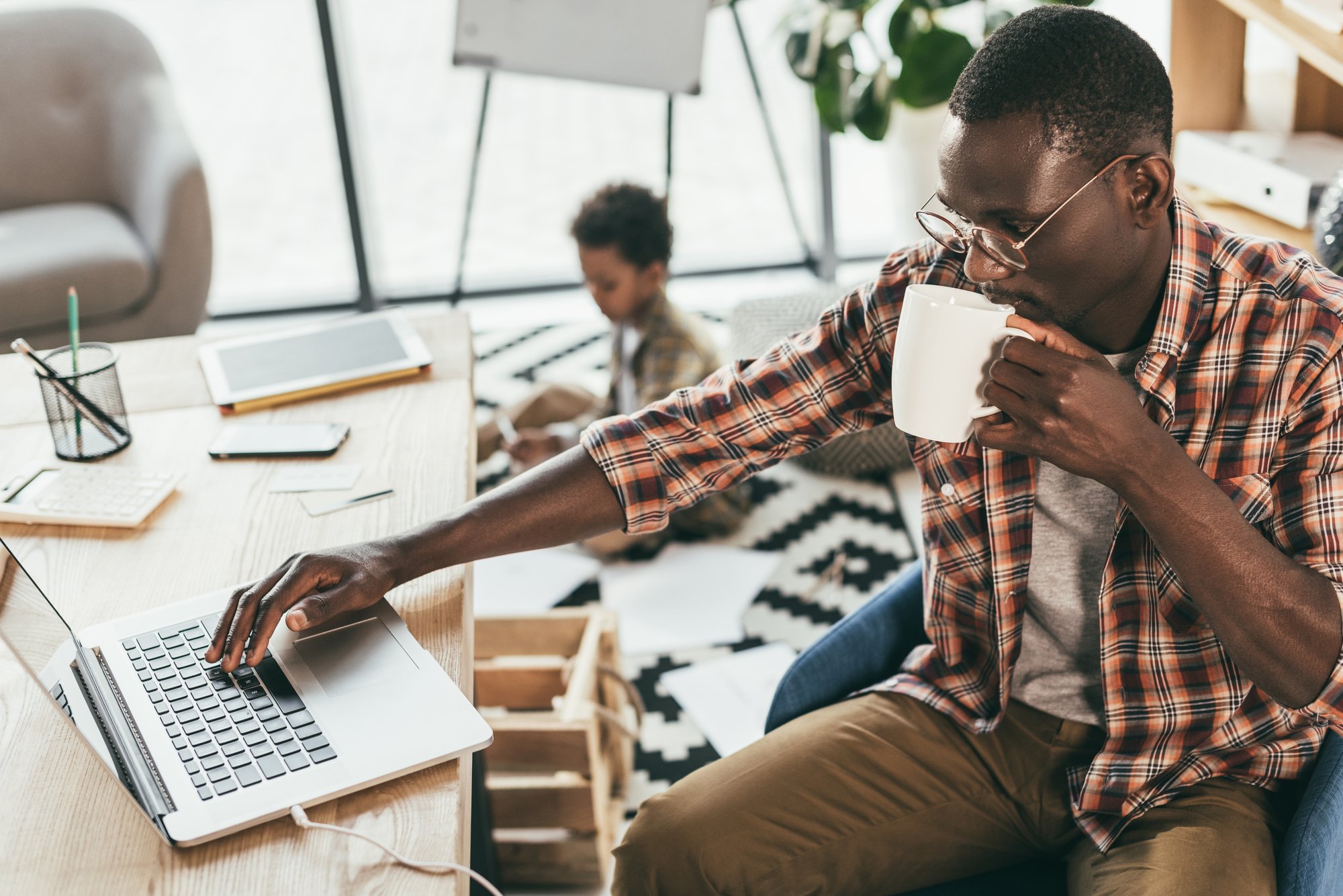 African american father and son in office