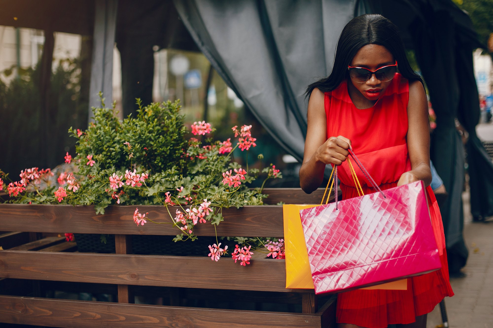 Beautiful black girl with shopping bags in a city