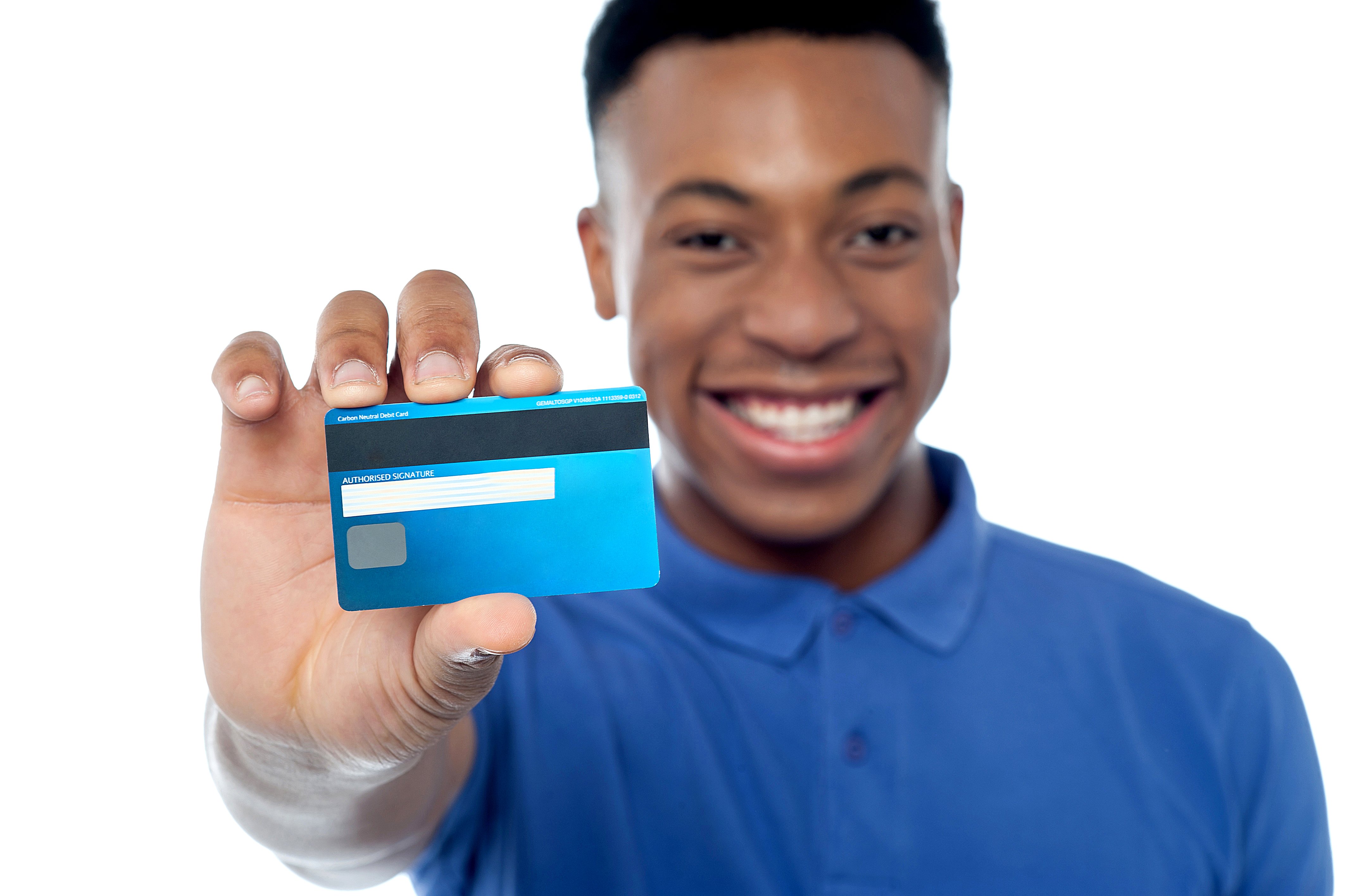 Portrait of young man holding credit card