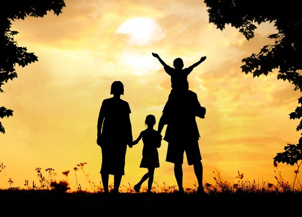 Happy family on sunset in nature